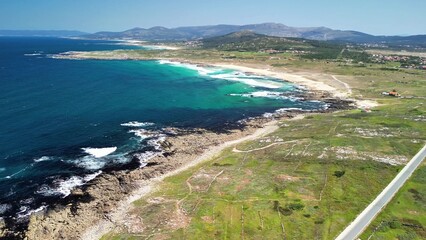 Experience the Stunning Coastal Landscape Featuring Waves and Lush Greenery All Around