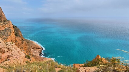 Fototapeta premium Experience breathtaking coastal views with turquoise waters and dramatic rocky cliffs