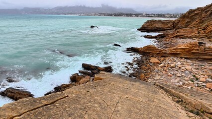 Captivating Picturesque Coastal View featuring Waves crashing on a Rocky Shoreline