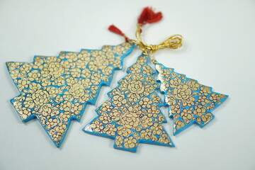 Hand-painted papier-mâché Christmas goodies by Kaar Kash, featuring stars, bells, trees, and more—crafted for hanging on Christmas trees and adding artisanal charm to festive décor.

