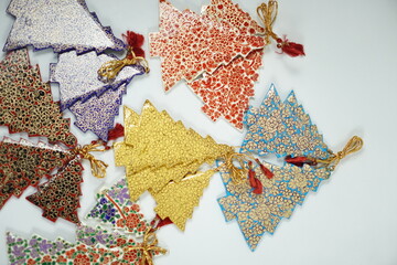 Hand-painted papier-mâché Christmas goodies by Kaar Kash, featuring stars, bells, trees, and more—crafted for hanging on Christmas trees and adding artisanal charm to festive décor.

