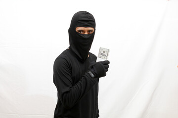 thief holding many dollar bills isolated on white background