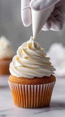  Mid-piping moment: smooth buttercream curls onto a cupcake, with gloved hands gently squeezing. Soft light and a clean kitchen counter create a serene scene.  