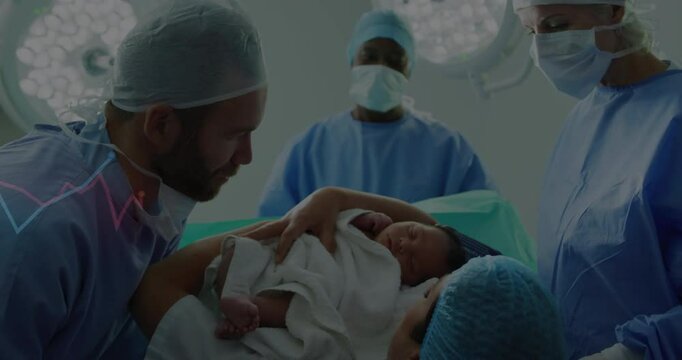 Post-cesarean nurse lifting newborn into mother's arms in OR, ECG graphic pulsing over scrubs