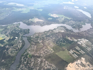Aerial view of Berlin suburbs with river, forests, and residential areas in Germany