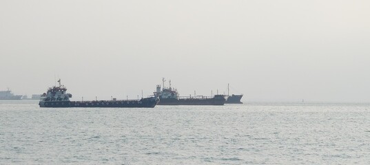 Cargo Ships Anchored on a Calm Sea