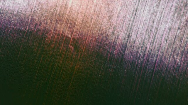 Close-up of colorful construction paper texture with soft, fluctuating shadows creating a subtle, dynamic background loop.
