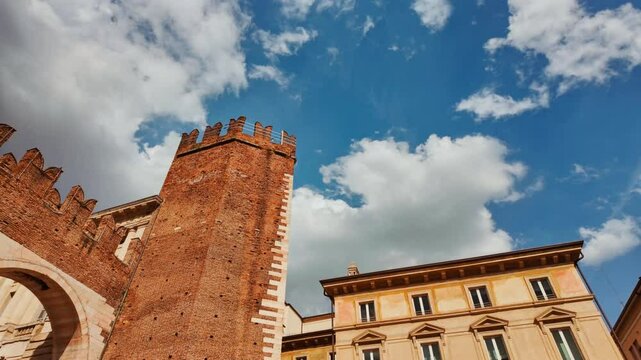 Twin ochre stone gateways with crenellated towers marking the ancient boundary at I Portoni della Bra City Gates, Verona, Veneto, Italy