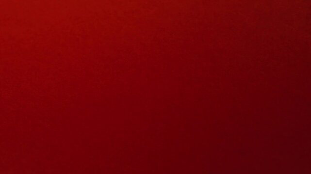Close-up of colorful construction paper texture with soft, fluctuating shadows creating a subtle, dynamic background loop.
