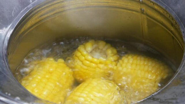 boil corn in a concave pan with boiling hot water