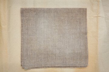 natural color folded linen serviette, texture background 