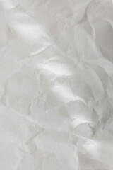 old crumbled paper with lights and shadows, texture background