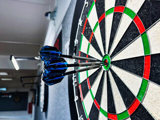 dart in the center of a dartboard 150 bull