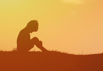 Sad upset little boy child silhouette 