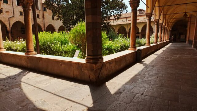 The Cloisters of the Basilica of St. Anthony form a serene cloistered courtyard ringed by frescoed arcades, Padova, Padua, Veneto, Italy
