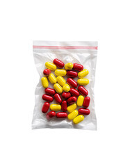 A white plastic bag containing red and yellow capsules from a hospital. On an isolated transparent background,