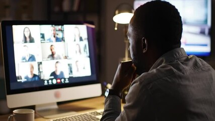 African American man participates in a virtual meeting with diverse colleagues from his home office - Powered by Adobe