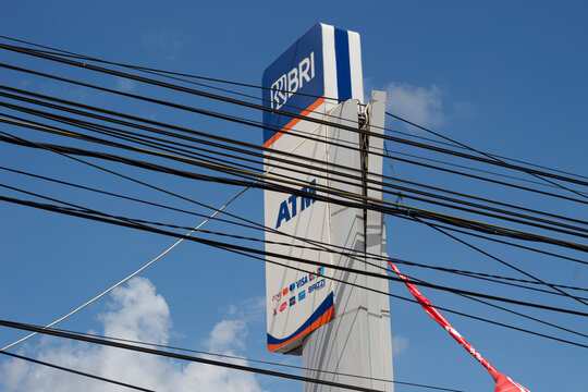 BRI ATM Sign and Tangled Overhead Wires in Mataram, Lombok, Indonesia - 24 August 2024