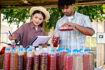 Agricultural students produce organic fertilizers, natural gardener compost tea prepared for agriculture with documenting biofertilizer production