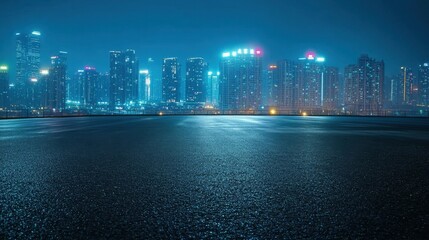 Fototapeta premium Cityscape at Night from Empty Asphalt.