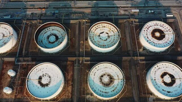 Aerial view or top view oil terminal. Crude oil storage tanks (storage tank) or tank farms are areas used to store large quantities of crude oil before it is taken to the refinery for refining.