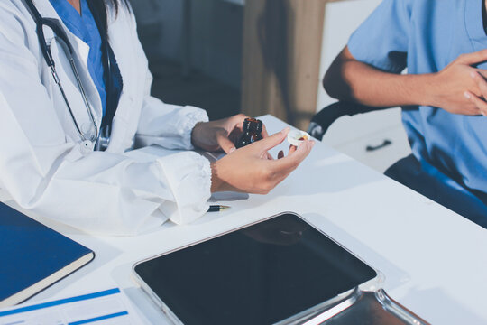 Young brunette woman having consultation at doctor office during