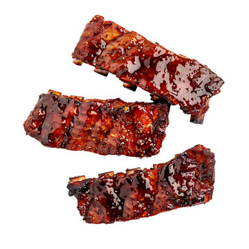 Three delicious bbq pork ribs isolated on transparent background