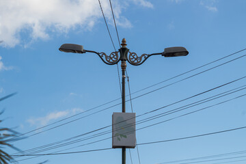 Electricity Network and Lighting Against Sky Background