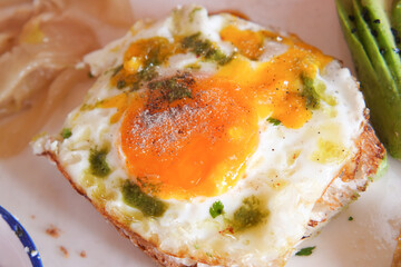 Delicious egg dish served on toast with fresh herbs