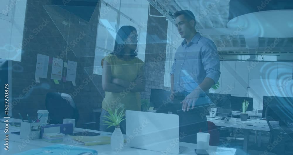 Poster man leaning and pointing at laptop initiating animated business charts guiding colleague to action