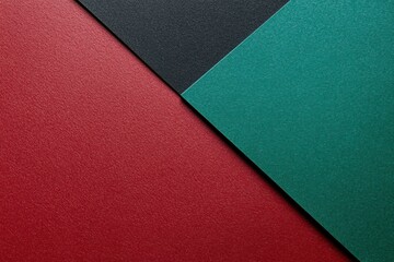 Fototapeta premium Colorful Textured Paper in Red, Black, and Green Arranged Diagonally