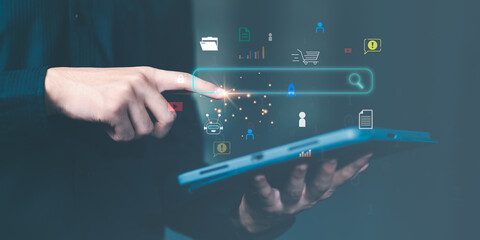 Businessman searching for business information through virtual screen,Searching for information he...