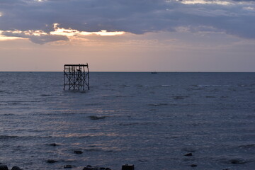 The sea and evening light with rain clouds,  sun and clouds, Evening sunset over the sea during the...