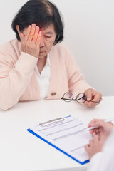 Elderly woman Patient having Eye ache and consulting Doctor to Eye disease. Senior Medical...