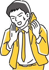 スマホを耳に当てて謝る男性