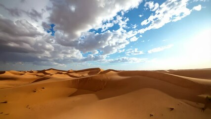 Expansive sand dune landscape under blue sky and dramatic cumulus clouds in arid desert environment with rippled sand formations - Powered by Adobe