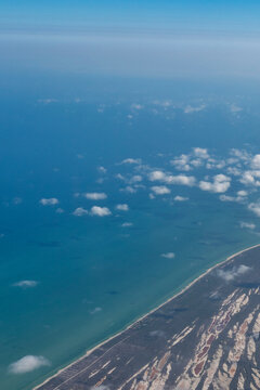 Fototapeta beach as seen from an airplane window vertical