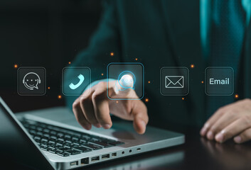 Contact us or the customer support hotline to connect. Businessman touching on virtual screen contact icons. Connecting line, email, AI chat, internet.