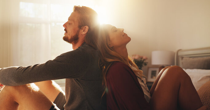 Love, relax and support with couple in bedroom of home together for bonding or morning romance. Dating, rest or wellness with man and woman sitting on bed in apartment for safety, security or trust