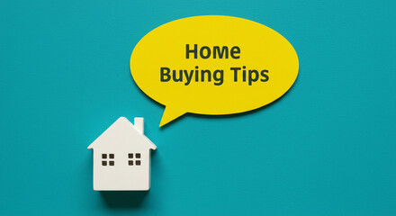 A white house miniature with a yellow speech bubble saying home buying tips on a blue background