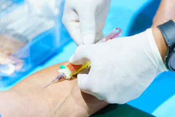 Close up hand collecting blood sample for diagnosis and treatment patient in the hospital.Laboratory technician taking blood for blood chemistry analysis