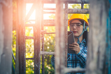 Young female project manager supervising construction work at residential building project.