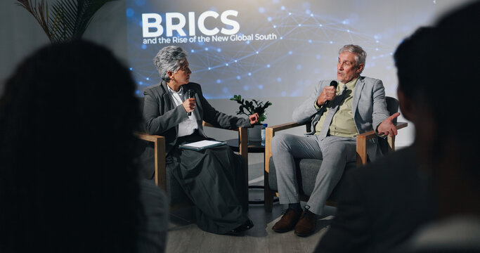 Interview, presentation or speech with business people on stage for BRICS conference or discussion. Development, microphone and question with mature speakers in auditorium for international trade