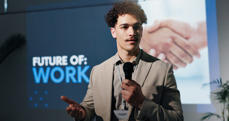 Business, microphone and speech with man in auditorium for presentation on future of work. Seminar,...