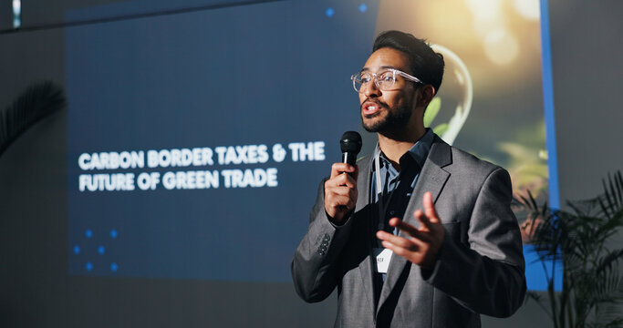 Man, speaker and talk with at conference for carbon border taxes, green trade and future speech. Person, public speaking and solution for eco friendly tariff, global exchange and ecology supply chain