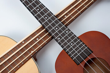 Four-string bass ukulele with wooden body and built-in tuner and pickup.