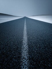 A straight road in the middle of magnificent sand dunes, dramatic photo, simple line drawing, symmetrical composition, at dusk, master of landscape photography, film emulsion fading effect