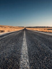 A straight road in the middle of magnificent sand dunes, dramatic photo, simple line drawing, symmetrical composition, at dusk, master of landscape photography, film emulsion fading effect