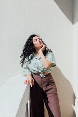 Portrait of a beautiful brunette woman in summer clothes