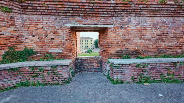 Ponte di Castelvecchio, Scaliger Bridge and Adige river form a historic medieval crossing of fortified brick arches over the flowing water, Verona, Veneto, Italy